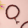 Beautiful handcrafted Red Chandan Bracelet made from pure red sandalwood beads, designed for enhancing spiritual balance, inner strength, and daily protection during meditation and pooja. India’s Largest Pooja Accessories Brand - www.satvikstore.in
