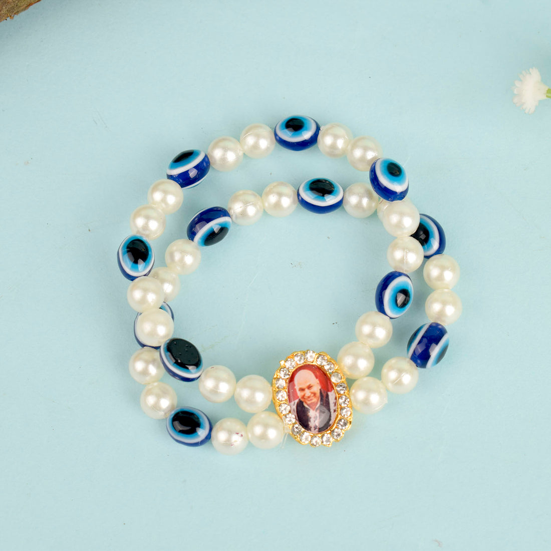 White Pearl with Evil Eye Double Layer Guruji Swaroop Bracelet featuring luminous pearls and a protective blue evil eye bead with Jai Guruji Swaroop – perfect for spiritual wear, protection, and gifting. India’s Largest Pooja Accessories Brand – www.satvikstore.in