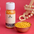 Yellow Chandan Tika (Saffron Chandan Tilak) Danedar for forehead application during puja, meditation, and spiritual rituals – India’s Largest Pooja Accessories Brand – www.satvikstore.in