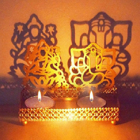 Decorative Lord Ganesh and Goddess Lakshmi Shadow Diya crafted in metal, radiating divine silhouettes of Ganpati and Lakshmi when lit—perfect for Diwali, pooja room, or spiritual gifting. India’s Largest Pooja Accessories Brand – www.satvikstore.in