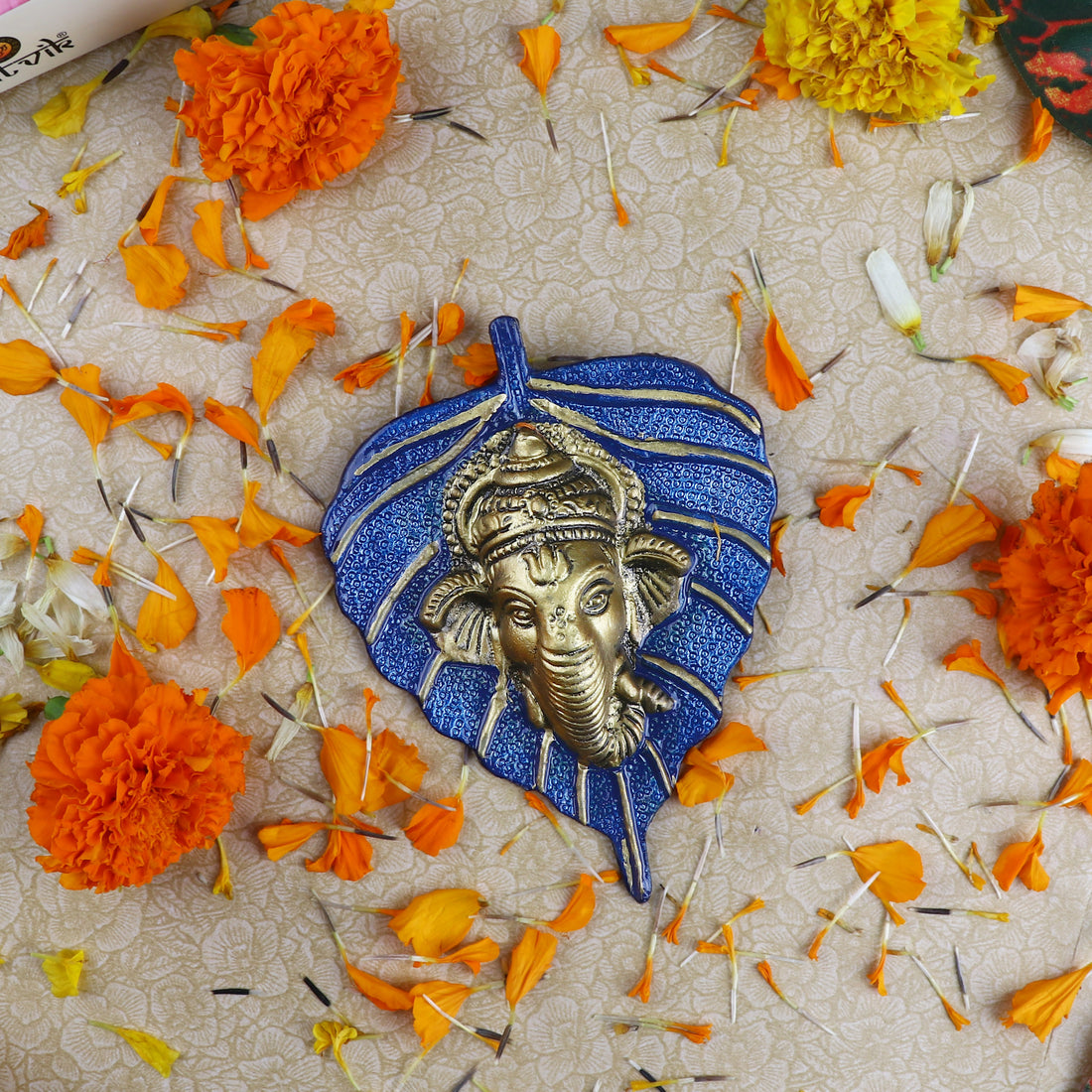 1 Pc Lord Ganesh Face on Leaf Patta Wall Hanging - Blue